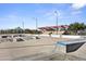 Concrete skatepark with ramps and seating area at 41007 N Harbour Town Way, Anthem, AZ 85086