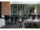 Refined restaurant setting with a wine rack, piano, and set tables at 41007 N Harbour Town Way, Anthem, AZ 85086