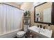 Simple bathroom with a single vanity, toilet, and bathtub at 42949 N Voyage Trl, Phoenix, AZ 85086