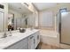 Clean bathroom with a double vanity, soaking tub, and walk-in shower at 42949 N Voyage Trl, Phoenix, AZ 85086