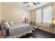 Spacious bedroom with a wooden bed frame and plenty of natural light at 42949 N Voyage Trl, Phoenix, AZ 85086