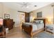 Spacious bedroom with wood flooring and a sliding barn door at 42949 N Voyage Trl, Phoenix, AZ 85086