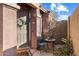 Inviting front patio with seating area and small table, perfect for relaxing at 42949 N Voyage Trl, Phoenix, AZ 85086