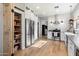 Bright kitchen with stainless steel refrigerator, ample storage, and wood flooring at 42949 N Voyage Trl, Phoenix, AZ 85086