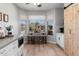 Cozy kitchen nook with built-in bench seating and a view of the backyard at 42949 N Voyage Trl, Phoenix, AZ 85086