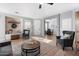 Bright and airy living room with hardwood floors and cozy seating at 42949 N Voyage Trl, Phoenix, AZ 85086