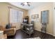 Home office with a desk, chair, and plenty of natural light at 42949 N Voyage Trl, Phoenix, AZ 85086