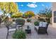 Comfortable backyard patio with seating area and basketball court at 4516 E Madre Del Oro Dr, Cave Creek, AZ 85331