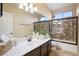 Bathroom with single vanity, shower/tub combo, and tile flooring at 4516 E Madre Del Oro Dr, Cave Creek, AZ 85331
