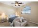 Cozy bedroom with comfortable seating and a large window at 4516 E Madre Del Oro Dr, Cave Creek, AZ 85331