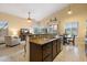 Open kitchen with granite island, stainless steel appliances, and breakfast bar at 4516 E Madre Del Oro Dr, Cave Creek, AZ 85331