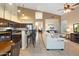 Open floor plan boasting a spacious kitchen with island and adjacent living room at 4516 E Madre Del Oro Dr, Cave Creek, AZ 85331