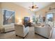 Relaxing living area with plush seating, large TV, and plenty of natural light at 4516 E Madre Del Oro Dr, Cave Creek, AZ 85331