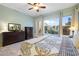 Spacious main bedroom with backyard view, ceiling fan, and large dresser at 4516 E Madre Del Oro Dr, Cave Creek, AZ 85331
