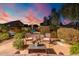Peaceful patio seating area with a view of the backyard and landscaping at 4516 E Madre Del Oro Dr, Cave Creek, AZ 85331