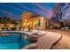Stunning pool area with a patio and seating area, perfect for summer evenings at 4516 E Madre Del Oro Dr, Cave Creek, AZ 85331