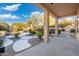Covered patio overlooking a refreshing pool and lush landscaping at 4516 E Madre Del Oro Dr, Cave Creek, AZ 85331