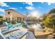 Inviting backyard oasis with a large pool and patio furniture at 4516 E Madre Del Oro Dr, Cave Creek, AZ 85331