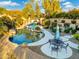 Inviting kidney shaped pool with surrounding patio and landscaping at 4516 E Madre Del Oro Dr, Cave Creek, AZ 85331