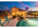 Inviting pool and spa with relaxing patio furniture and lights at 4516 E Madre Del Oro Dr, Cave Creek, AZ 85331