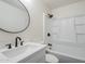 Clean bathroom with white fixtures, a bathtub, and a modern vanity at 4720 E Belleview St, Phoenix, AZ 85008