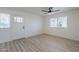 Simple bedroom with hardwood floors and a window at 4720 E Belleview St, Phoenix, AZ 85008