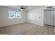 Simple bedroom with hardwood floors and a window at 4720 E Belleview St, Phoenix, AZ 85008