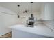 Modern kitchen with white cabinets, quartz countertops, and stainless steel appliances at 4720 E Belleview St, Phoenix, AZ 85008