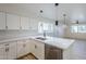 Updated kitchen featuring white shaker cabinets, quartz countertops, and stainless steel dishwasher at 4720 E Belleview St, Phoenix, AZ 85008