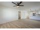 Bright living room with hardwood floors and a ceiling fan at 4720 E Belleview St, Phoenix, AZ 85008