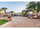 Spacious backyard with pergola, outdoor kitchen, and fireplace at 4811 E Patrick Ln, Phoenix, AZ 85054