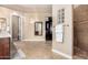 Bathroom with shower, glass block feature and tile flooring at 4811 E Patrick Ln, Phoenix, AZ 85054