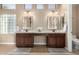 Double vanity bathroom with large mirrors and tile floors at 4811 E Patrick Ln, Phoenix, AZ 85054