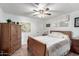 Bedroom with ceiling fan and wood dresser at 5241 E Lindstrom Ln, Mesa, AZ 85215
