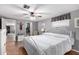 Bright bedroom with a ceiling fan and large bed at 5241 E Lindstrom Ln, Mesa, AZ 85215