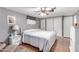 Relaxing bedroom with a comfortable bed and wood floors at 5241 E Lindstrom Ln, Mesa, AZ 85215