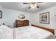 Bedroom with dresser and ceiling fan at 5241 E Lindstrom Ln, Mesa, AZ 85215