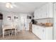 Bright kitchen with white cabinets and stainless steel appliances at 5241 E Lindstrom Ln, Mesa, AZ 85215