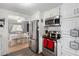 Modern kitchen with stainless steel appliances and white cabinets at 5241 E Lindstrom Ln, Mesa, AZ 85215
