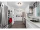 Clean and bright kitchen with white cabinets and stainless steel appliances at 5241 E Lindstrom Ln, Mesa, AZ 85215