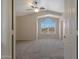 Main bedroom with vaulted ceiling and large window at 6131 W Irma Ln, Glendale, AZ 85308