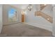 High ceiling living room with tile and carpet flooring at 6131 W Irma Ln, Glendale, AZ 85308