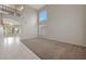 Living room with high ceilings and view to kitchen area at 6131 W Irma Ln, Glendale, AZ 85308