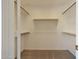 Large walk-in closet with double hanging rods at 6131 W Irma Ln, Glendale, AZ 85308