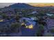 Night view of a home nestled in a mountain community at 7760 E Carefree Dr, Carefree, AZ 85377