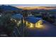 Luxury home at dusk with mountain and city views at 7760 E Carefree Dr, Carefree, AZ 85377