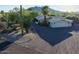 Aerial view of single-story home with desert landscaping and driveway at 7760 E Carefree Dr, Carefree, AZ 85377
