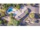 Aerial view of a home's roofline, pool, and surrounding landscaping at 7760 E Carefree Dr, Carefree, AZ 85377