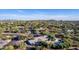 Aerial view showing single-story home, pool, and mountain backdrop at 7760 E Carefree Dr, Carefree, AZ 85377