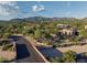 Desert landscape with a custom home and mountain views at 7760 E Carefree Dr, Carefree, AZ 85377